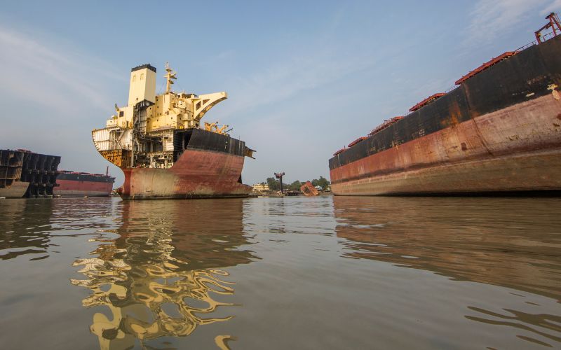 Vessels beached at the Alang tideline before dismantling begins